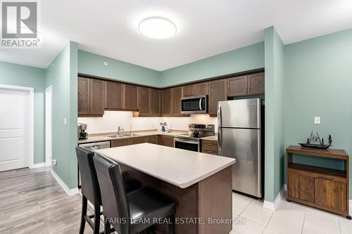 406 - 161 Wellington Street E, New Tecumseth, ON - Indoor Photo Showing Kitchen With Double Sink