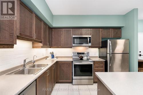 406 - 161 Wellington Street E, New Tecumseth, ON - Indoor Photo Showing Kitchen With Double Sink