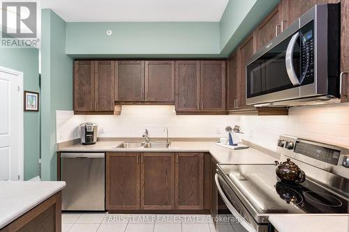 406 - 161 Wellington Street E, New Tecumseth, ON - Indoor Photo Showing Kitchen With Double Sink