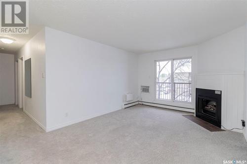 306B 4040 8Th Street E, Saskatoon, SK - Indoor With Fireplace