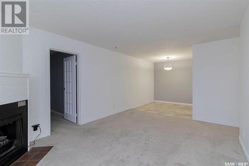 306B 4040 8Th Street E, Saskatoon, SK - Indoor With Fireplace