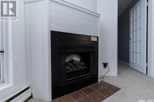 306B 4040 8Th Street E, Saskatoon, SK - Indoor Photo Showing Other Room With Fireplace