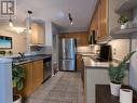 47B - 1084 Queen Street W, Mississauga, ON  - Indoor Photo Showing Kitchen With Stainless Steel Kitchen With Double Sink 