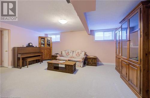 Rec room with light colored carpet and plenty of natural light - 42 River Run Road, Drayton, ON - Indoor