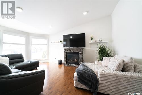 515 Antler Crescent, Warman, SK - Indoor Photo Showing Living Room With Fireplace