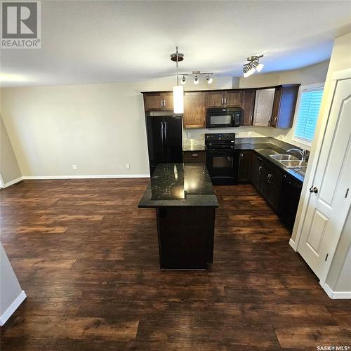 103 3440 Avonhurst Drive, Regina, SK - Indoor Photo Showing Kitchen With Double Sink