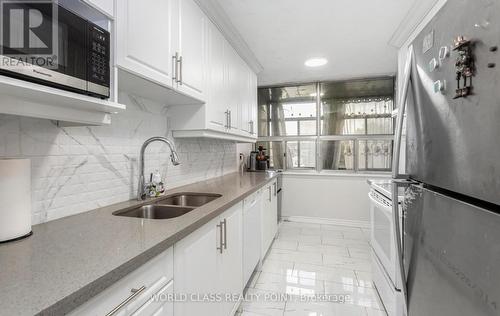 310 - 15 Kensington Road W, Brampton, ON - Indoor Photo Showing Kitchen With Double Sink