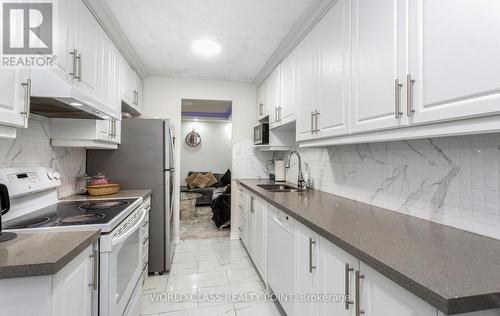 310 - 15 Kensington Road W, Brampton, ON - Indoor Photo Showing Kitchen With Double Sink