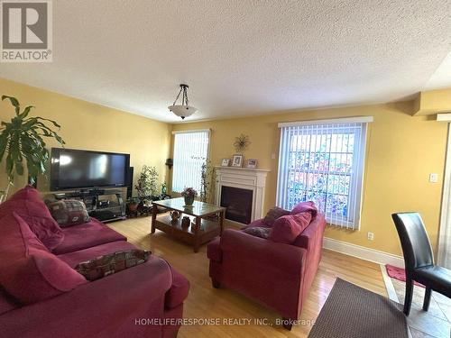 19 River Rock Crescent, Brampton, ON - Indoor Photo Showing Living Room With Fireplace