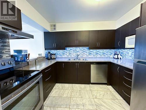 222 - 75 Bamburgh Circle, Toronto, ON - Indoor Photo Showing Kitchen With Double Sink With Upgraded Kitchen