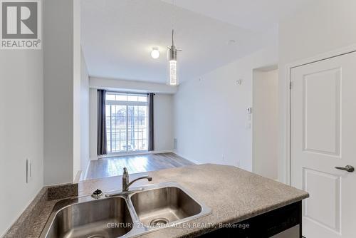 211 - 84 Aspen Springs Drive, Clarington, ON - Indoor Photo Showing Kitchen With Double Sink