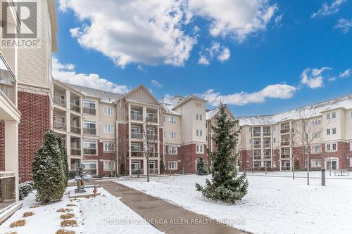 211 - 84 Aspen Springs Drive, Clarington, ON - Outdoor With Facade