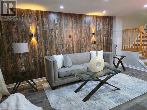 Living room featuring dark hardwood / wood-style flooring - 83 Bridlewreath Street, Kitchener, ON - Indoor