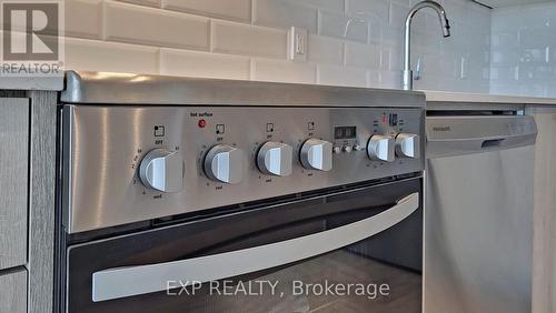 715 - 50 George Butchart Drive E, Toronto, ON - Indoor Photo Showing Kitchen