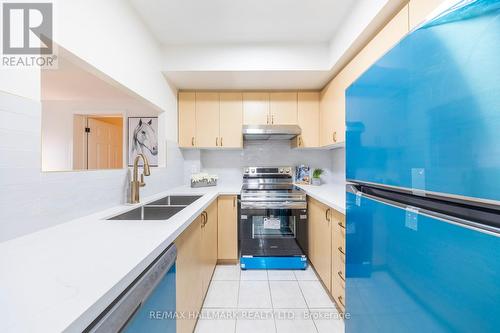 319 - 2351 Kennedy Road, Toronto, ON - Indoor Photo Showing Kitchen With Double Sink