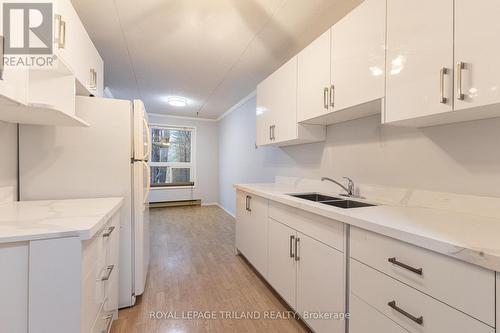 202 - 10 Lake Road, Lambton Shores (Grand Bend), ON - Indoor Photo Showing Kitchen With Double Sink