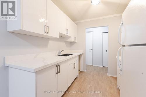 202 - 10 Lake Road, Lambton Shores (Grand Bend), ON - Indoor Photo Showing Kitchen With Double Sink