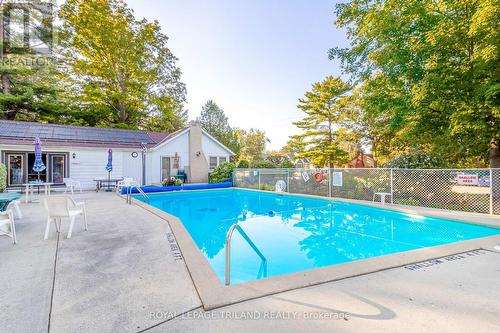 202 - 10 Lake Road, Lambton Shores (Grand Bend), ON - Outdoor With In Ground Pool With Backyard