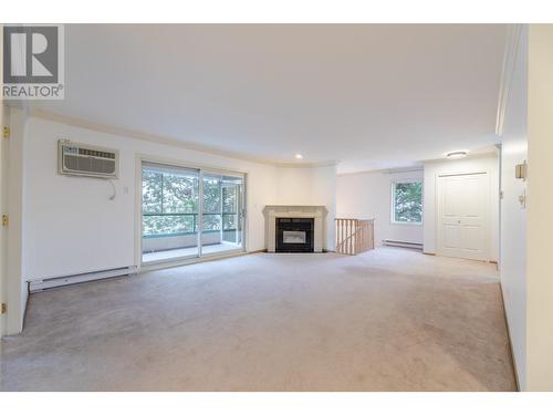 8907 Pineo Court Unit# 70, Summerland, BC - Indoor Photo Showing Living Room With Fireplace