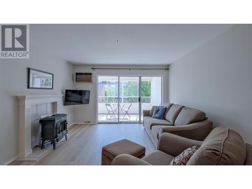 920 Argyle Street Unit# 203, Penticton, BC - Indoor Photo Showing Living Room With Fireplace