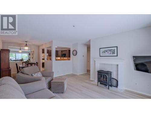 920 Argyle Street Unit# 203, Penticton, BC - Indoor Photo Showing Living Room With Fireplace