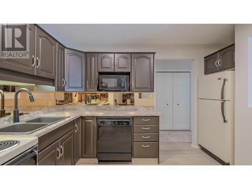 920 Argyle Street Unit# 203, Penticton, BC - Indoor Photo Showing Kitchen With Double Sink