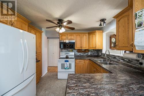 7713 Thompson Drive, Prince George, BC - Indoor Photo Showing Kitchen With Double Sink