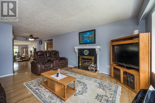 7713 Thompson Drive, Prince George, BC - Indoor Photo Showing Living Room With Fireplace