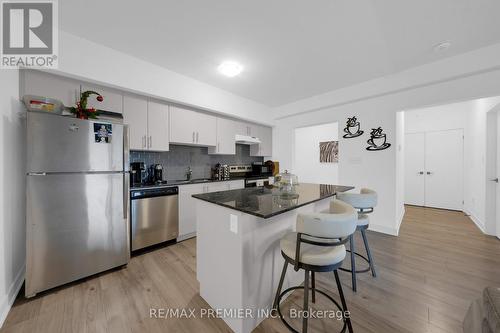 404 - 4 Spice Way, Barrie, ON - Indoor Photo Showing Kitchen With Stainless Steel Kitchen With Upgraded Kitchen