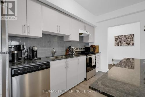 404 - 4 Spice Way, Barrie, ON - Indoor Photo Showing Kitchen With Stainless Steel Kitchen With Double Sink