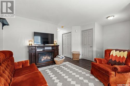 100 203 Herold Terrace, Saskatoon, SK - Indoor Photo Showing Living Room With Fireplace