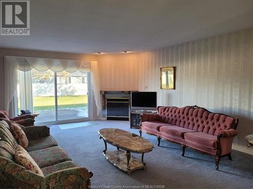 9770 Menard, Windsor, ON - Indoor Photo Showing Living Room With Fireplace