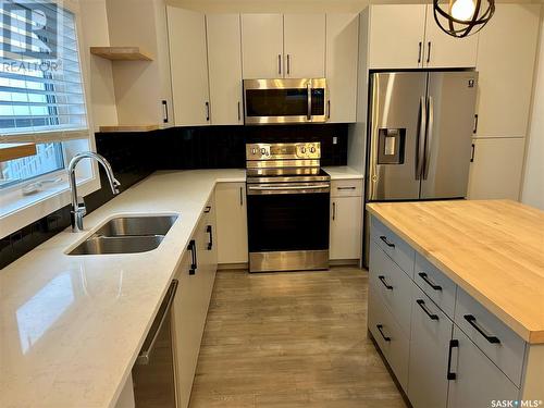 887 Mcfaull Rise, Saskatoon, SK - Indoor Photo Showing Kitchen With Double Sink