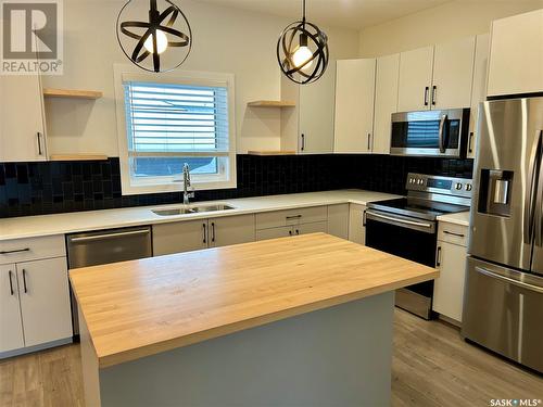 887 Mcfaull Rise, Saskatoon, SK - Indoor Photo Showing Kitchen With Double Sink