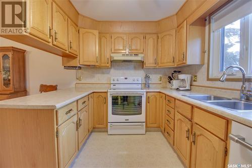 202 3130 Louise Street, Saskatoon, SK - Indoor Photo Showing Kitchen With Double Sink