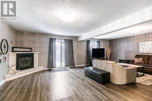 3861 Macmillan Drive, Val Caron, ON - Indoor Photo Showing Living Room With Fireplace