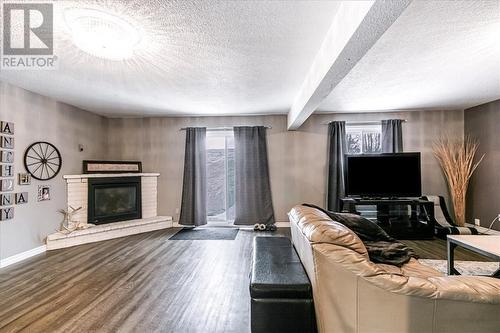 3861 Macmillan Drive, Val Caron, ON - Indoor Photo Showing Living Room With Fireplace