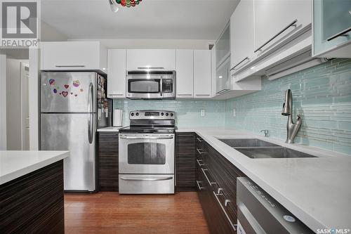 202 410 Hunter Road, Saskatoon, SK - Indoor Photo Showing Kitchen With Stainless Steel Kitchen With Double Sink With Upgraded Kitchen