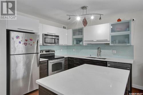 202 410 Hunter Road, Saskatoon, SK - Indoor Photo Showing Kitchen With Stainless Steel Kitchen With Double Sink With Upgraded Kitchen