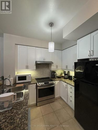 2310 - 70 Absolute Avenue, Mississauga, ON - Indoor Photo Showing Kitchen With Double Sink