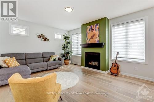 726 Cappamore Drive, Ottawa, ON - Indoor Photo Showing Living Room With Fireplace