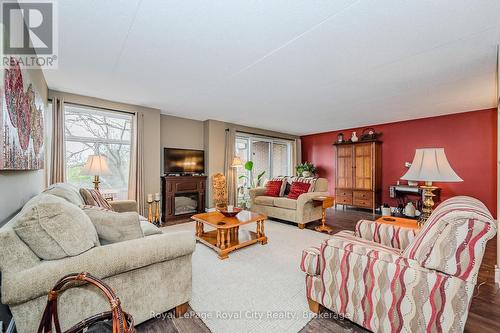 401 - 8 Christopher Court, Guelph (Hanlon Creek), ON - Indoor Photo Showing Living Room With Fireplace