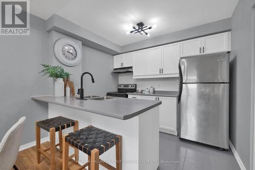 109 - 120 Aspen Springs Drive, Clarington, ON - Indoor Photo Showing Kitchen With Stainless Steel Kitchen With Double Sink