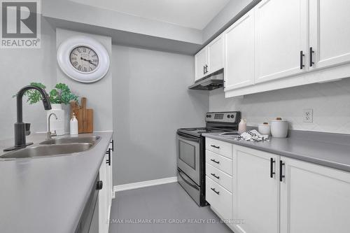 109 - 120 Aspen Springs Drive, Clarington, ON - Indoor Photo Showing Kitchen With Double Sink