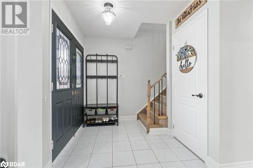 Foyer featuring light tile patterned floors - 50 Smith Drive, Georgetown, ON - Indoor Photo Showing Other Room