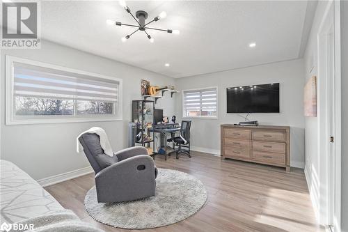 Living room featuring a chandelier and light hardwood / wood-style floors - 50 Smith Drive, Georgetown, ON - Indoor