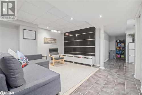 Tiled living room with a paneled ceiling and built in features - 50 Smith Drive, Georgetown, ON - Indoor Photo Showing Other Room