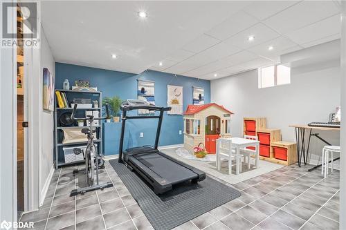 Exercise room with tile patterned floors - 50 Smith Drive, Georgetown, ON - Indoor Photo Showing Gym Room