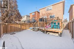 Snow covered house with a deck - 