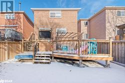 Snow covered house with a deck - 